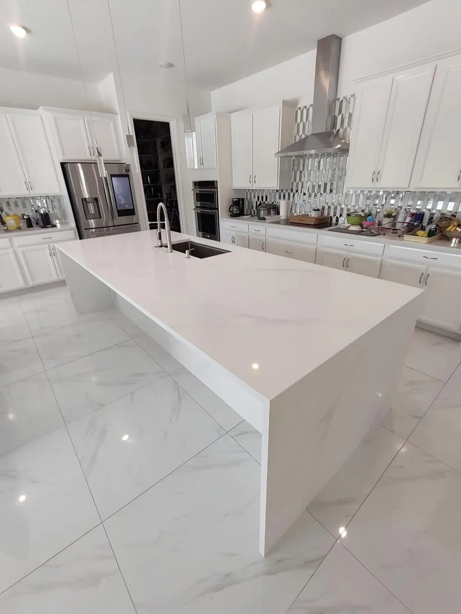 Waterfall island with the vein running down the panel, installed in a Central Florida kitchen